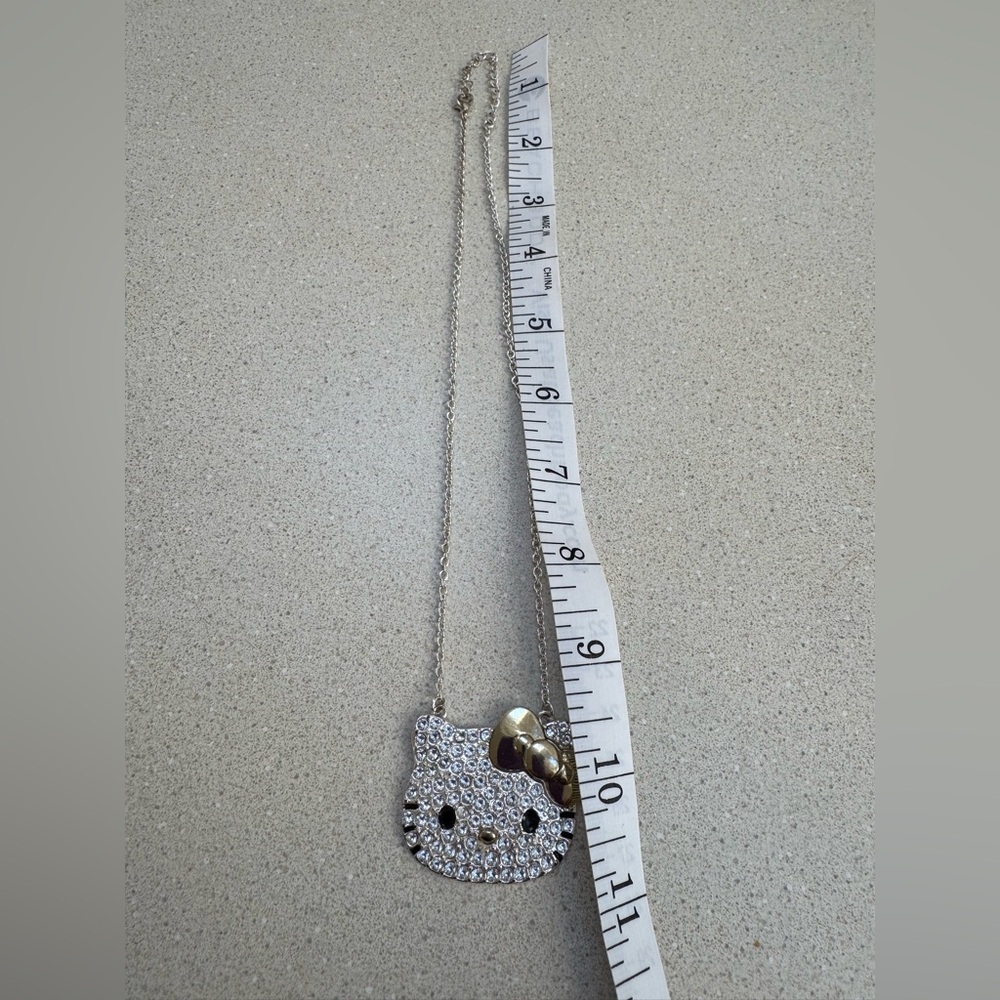 Hello Kitty Sanrio Pave Silver Crystal Necklace With A Gold Tone Bow And Nose - Picture 4 of 4